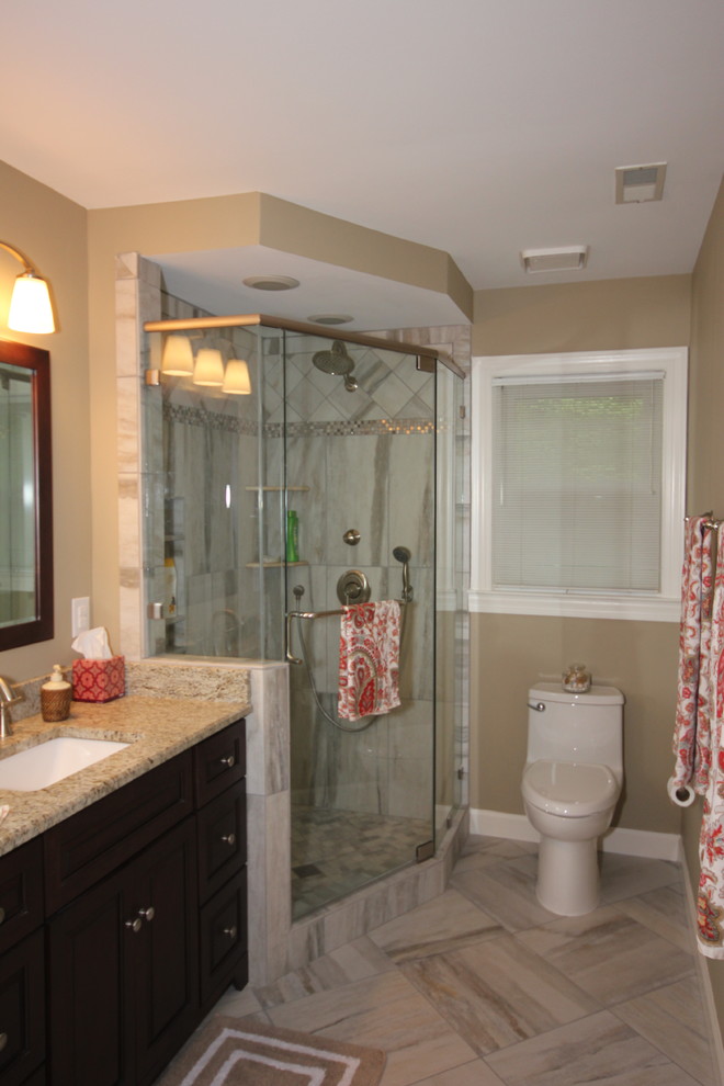 Design ideas for a traditional master bathroom in Raleigh with granite benchtops, porcelain tile and porcelain floors.