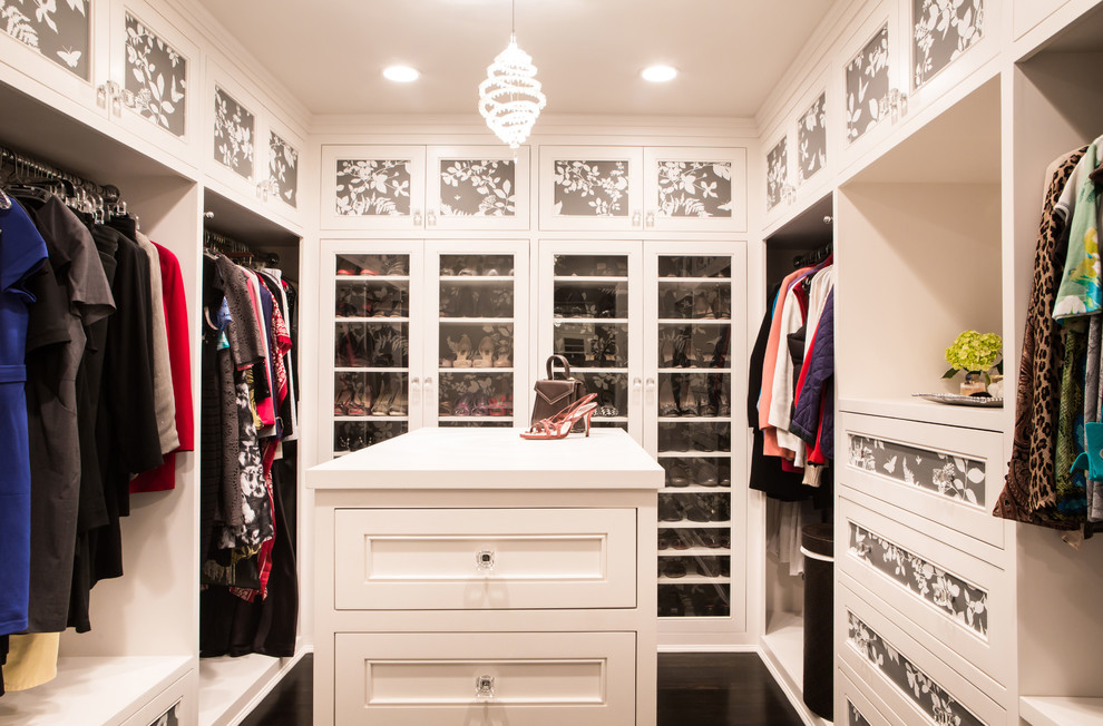Mid-sized traditional women's walk-in wardrobe in Los Angeles with recessed-panel cabinets and white cabinets.