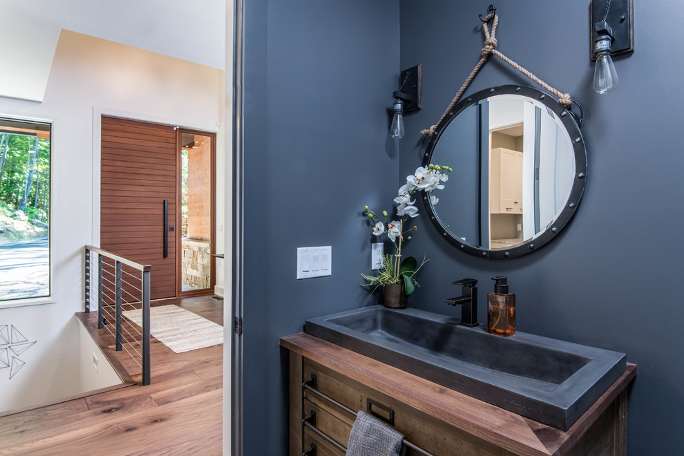 Organic Modern Mountain Home - A beautifully designed rustic modern entryway flows seamlessly into a charming powder room, showcasing a blend of organic materials, wood, stone, and sustainable design in this luxurious mountain home.
