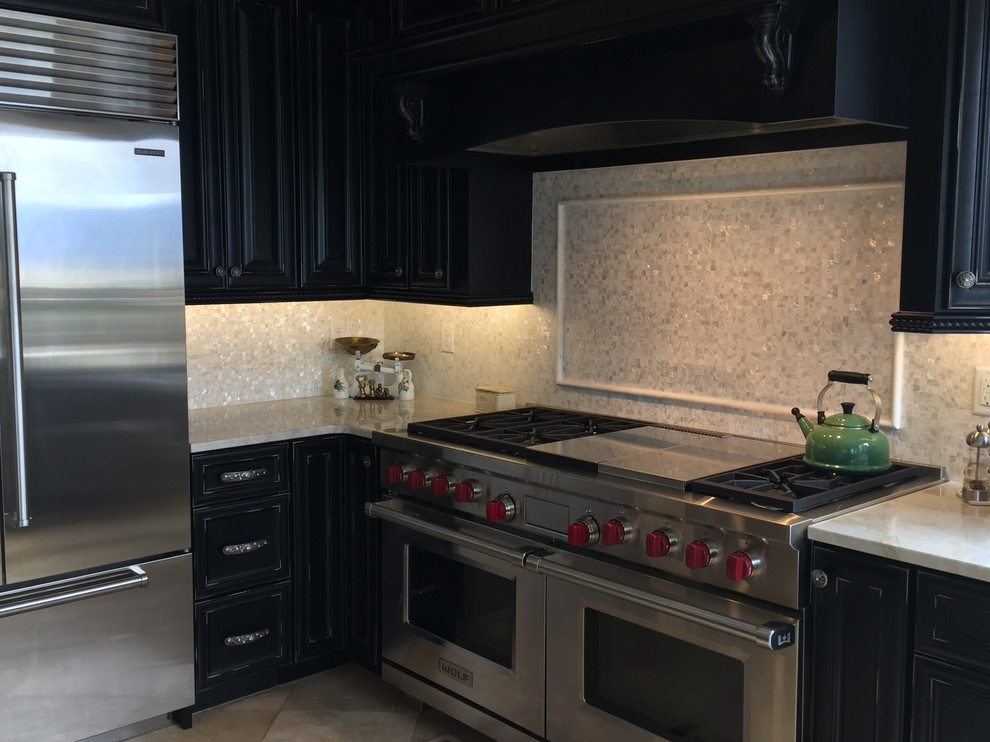 Inspiration for a large country u-shaped open plan kitchen in Denver with black cabinets, stainless steel appliances, ceramic floors and a peninsula.