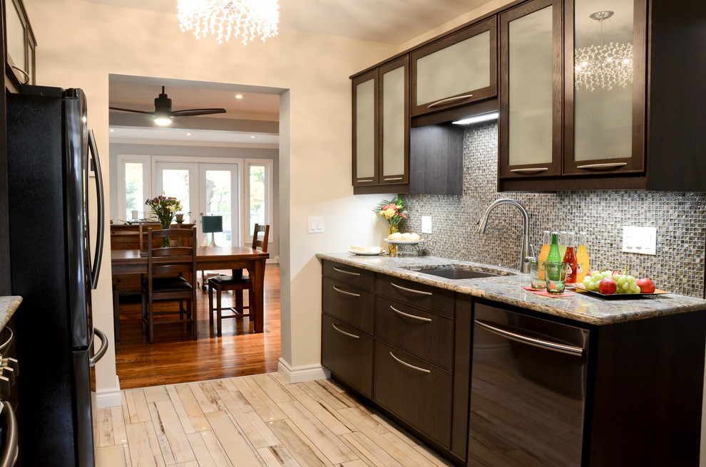 Example of a mid-sized transitional galley porcelain tile kitchen design in Ottawa with an undermount sink, glass-front cabinets, brown cabinets, quartz countertops, brown backsplash, glass sheet backsplash and stainless steel appliances