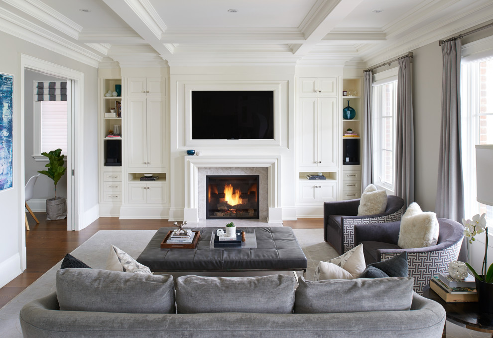 Inspiration for a large traditional open concept family room in Toronto with grey walls, dark hardwood floors, a tile fireplace surround, a wall-mounted tv, brown floor and coffered.