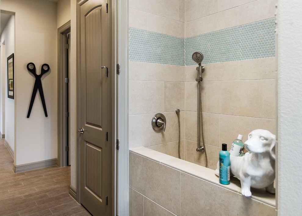 Inspiration for a large transitional galley porcelain tile home design remodel in Austin with an utility sink, raised-panel cabinets, dark wood cabinets, quartzite countertops, gray walls and a side-by-side washer/dryer