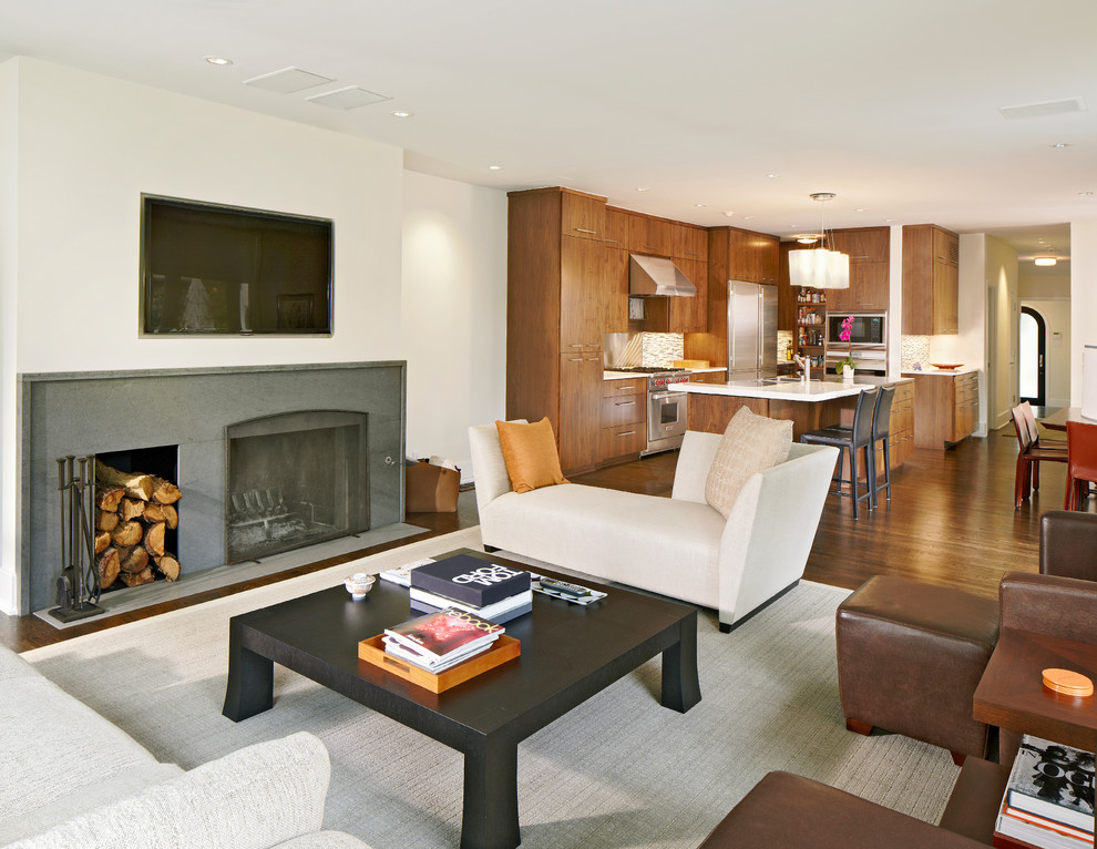 This is an example of a contemporary open concept living room in Dallas with a wall-mounted tv.