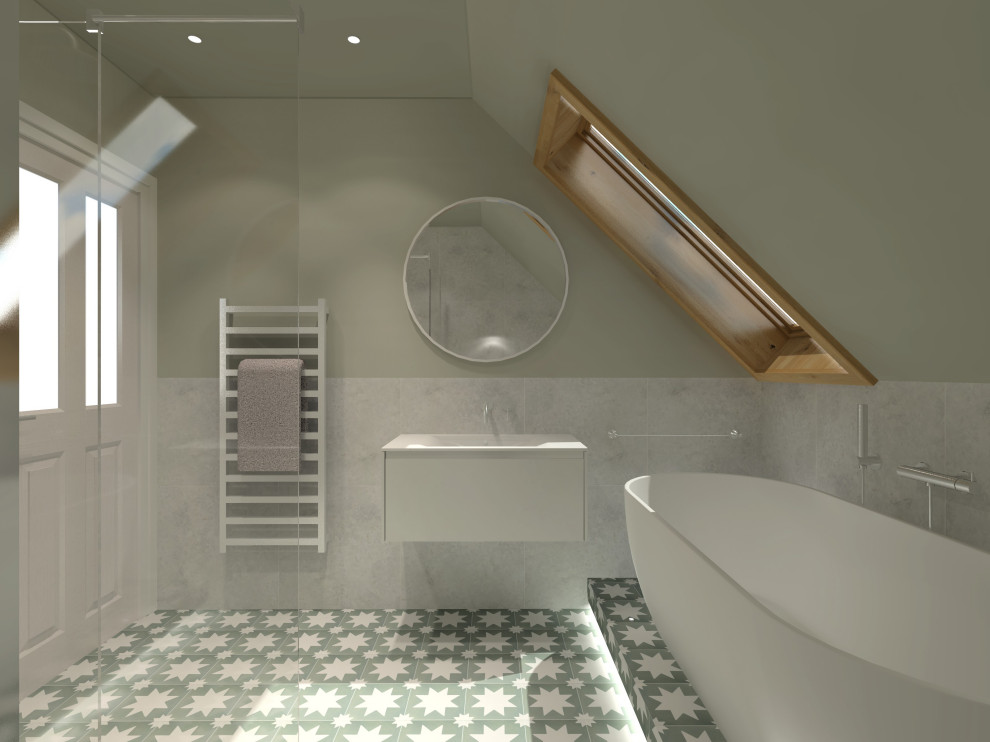 This is an example of a medium sized contemporary bathroom in Edinburgh with flat-panel cabinets, white cabinets, a freestanding bath, a walk-in shower, a wall mounted toilet, grey tiles, porcelain tiles, green walls, porcelain flooring, an integrated sink, solid surface worktops, green floors, an open shower, white worktops, a wall niche, a single sink, a floating vanity unit and a vaulted ceiling.