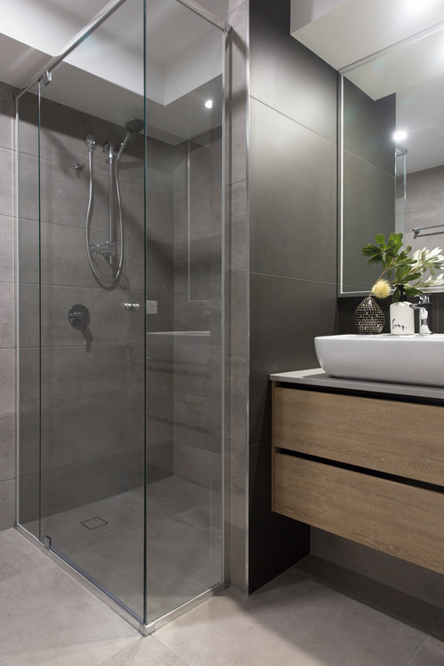 Stylish Solutions: Corner Showers with Gray Tile Backsplash