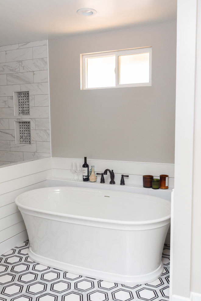Large farmhouse ensuite bathroom in San Diego with shaker cabinets, white cabinets, a freestanding bath, a corner shower, white tiles, ceramic tiles, grey walls, vinyl flooring, a built-in sink, quartz worktops, grey floors, an open shower, white worktops, a shower bench, double sinks and a built in vanity unit.