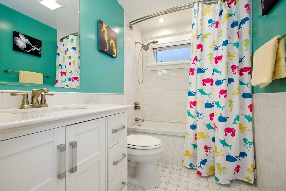Inspiration for a mid-sized arts and crafts 3/4 bathroom in San Francisco with an undermount tub, an undermount sink, white benchtops, recessed-panel cabinets, white cabinets, a shower/bathtub combo, a one-piece toilet, subway tile, green walls, ceramic floors, white floor and a shower curtain.