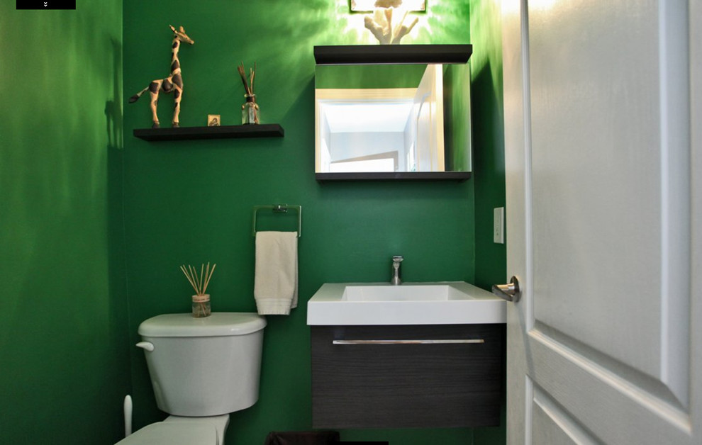 This is an example of a small contemporary powder room in Toronto with green walls, a wall-mount sink and white floor.