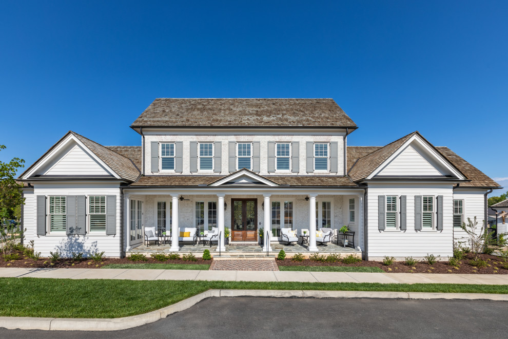 Example of a large classic white two-story concrete fiberboard and clapboard exterior home design in Atlanta with a shingle roof and a brown roof