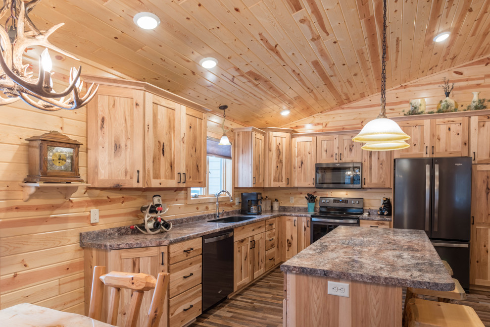 Mid-sized country l-shaped eat-in kitchen in Minneapolis with an undermount sink, shaker cabinets, medium wood cabinets, laminate benchtops, stainless steel appliances, linoleum floors, with island, multi-coloured floor and turquoise benchtop.