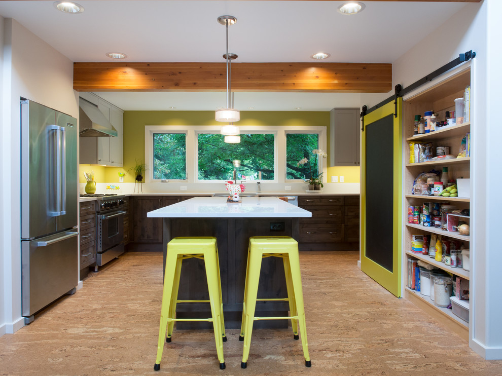 Mid-sized transitional l-shaped cork floor and beige floor kitchen photo in Seattle with a farmhouse sink, shaker cabinets, dark wood cabinets, quartz countertops, stainless steel appliances, an island, white backsplash, quartz backsplash and white countertops