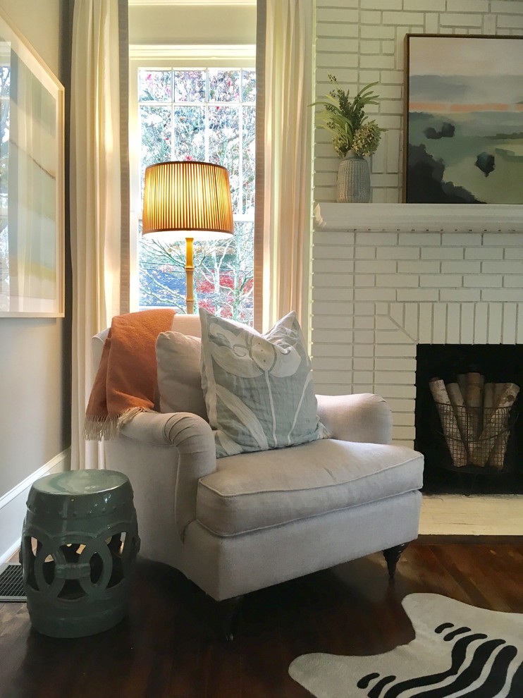 Living room - mid-sized transitional medium tone wood floor and brown floor living room idea in Atlanta with gray walls, a standard fireplace, a brick fireplace and no tv