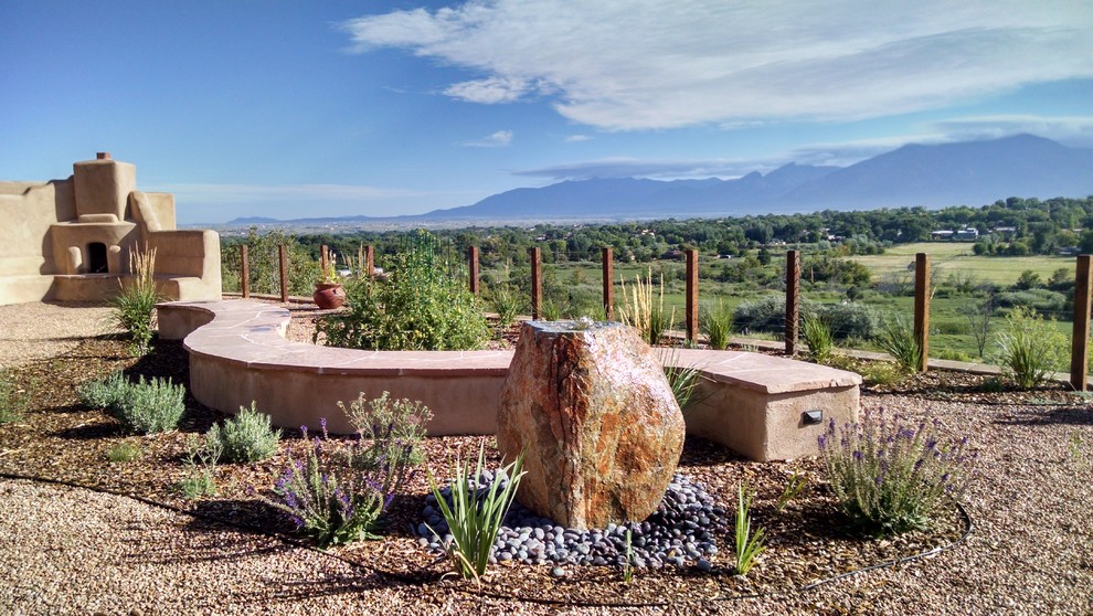 Full sun garden in Albuquerque with natural stone pavers for summer.