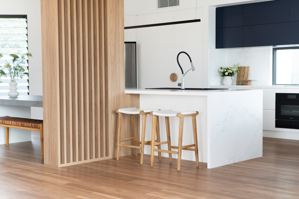 This is an example of a beach style kitchen in Sunshine Coast.