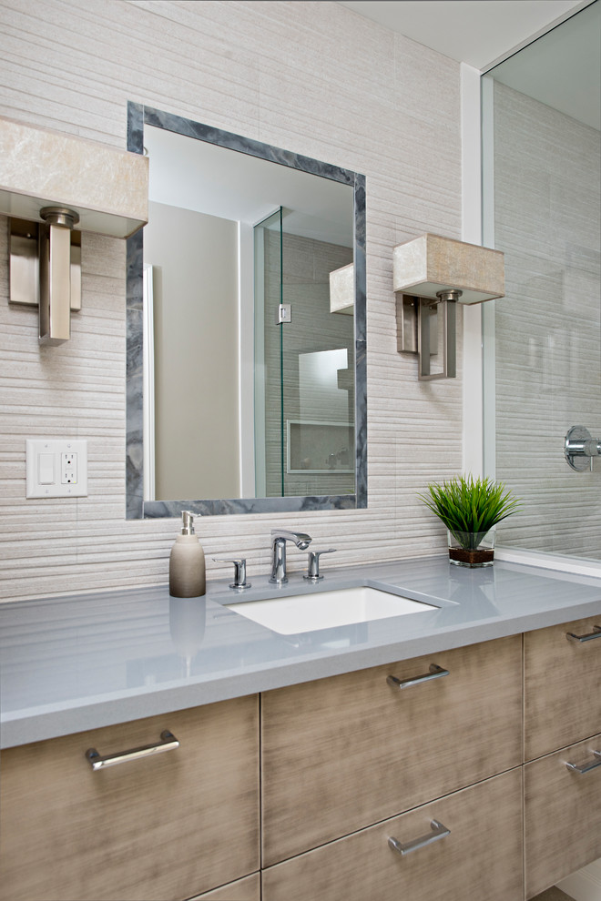 Photo of a mid-sized contemporary master bathroom in Toronto with flat-panel cabinets, medium wood cabinets, an alcove shower, a two-piece toilet, gray tile, porcelain tile, grey walls, porcelain floors, an undermount sink, engineered quartz benchtops, grey floor, a hinged shower door and blue benchtops.