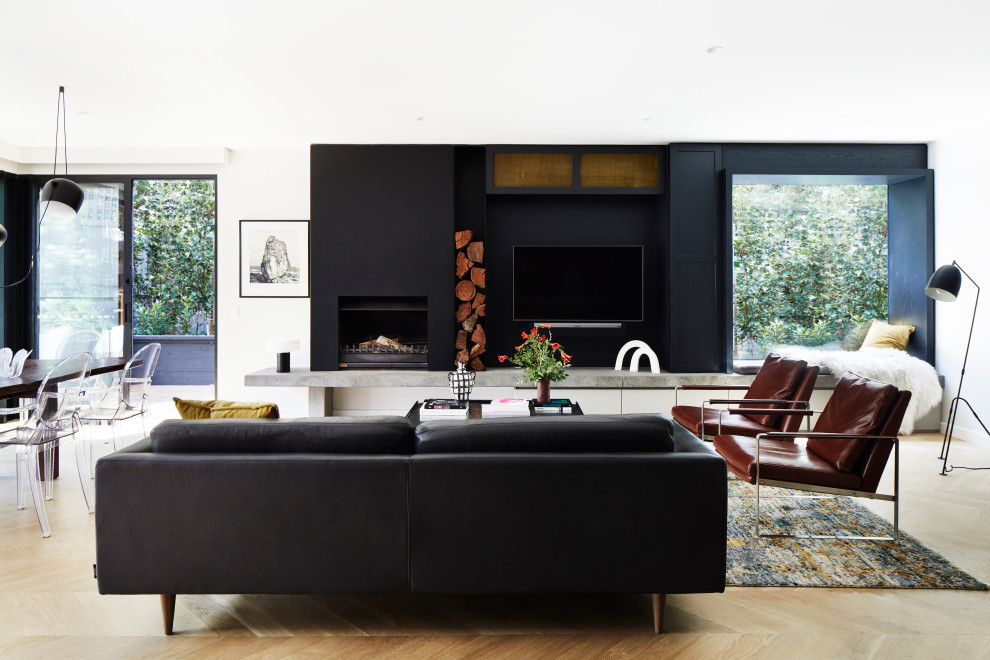 Photo of a contemporary open concept living room in Melbourne with a wall-mounted tv.