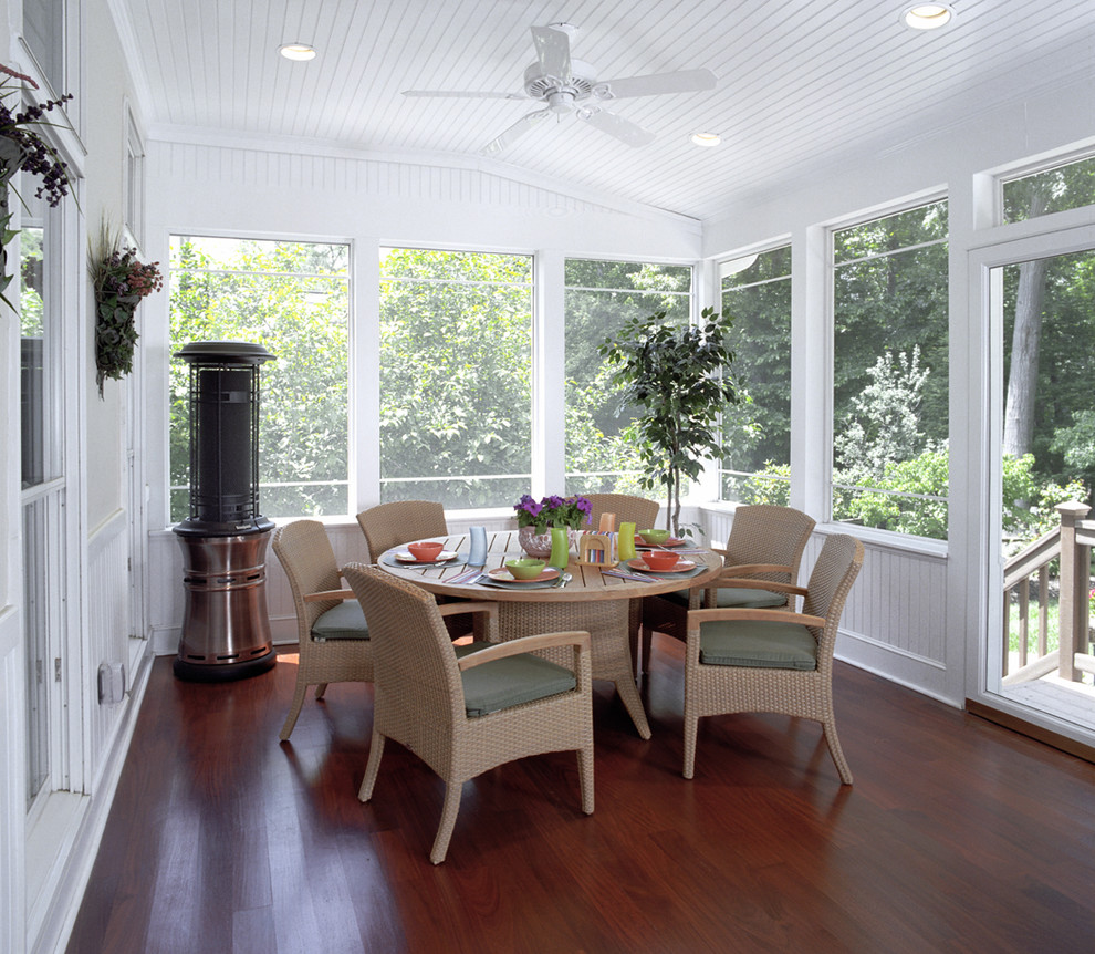 Traditional screened-in verandah in DC Metro with decking and a roof extension.
