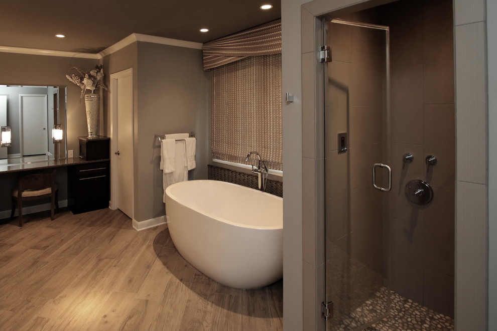 Inspiration for a transitional porcelain tile porcelain tile freestanding bathtub remodel with gray walls