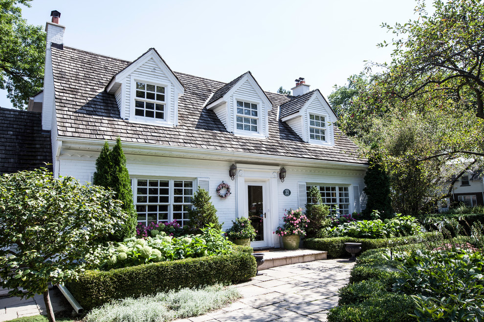 Inspiration for a large traditional two-storey brick white exterior in Toronto.