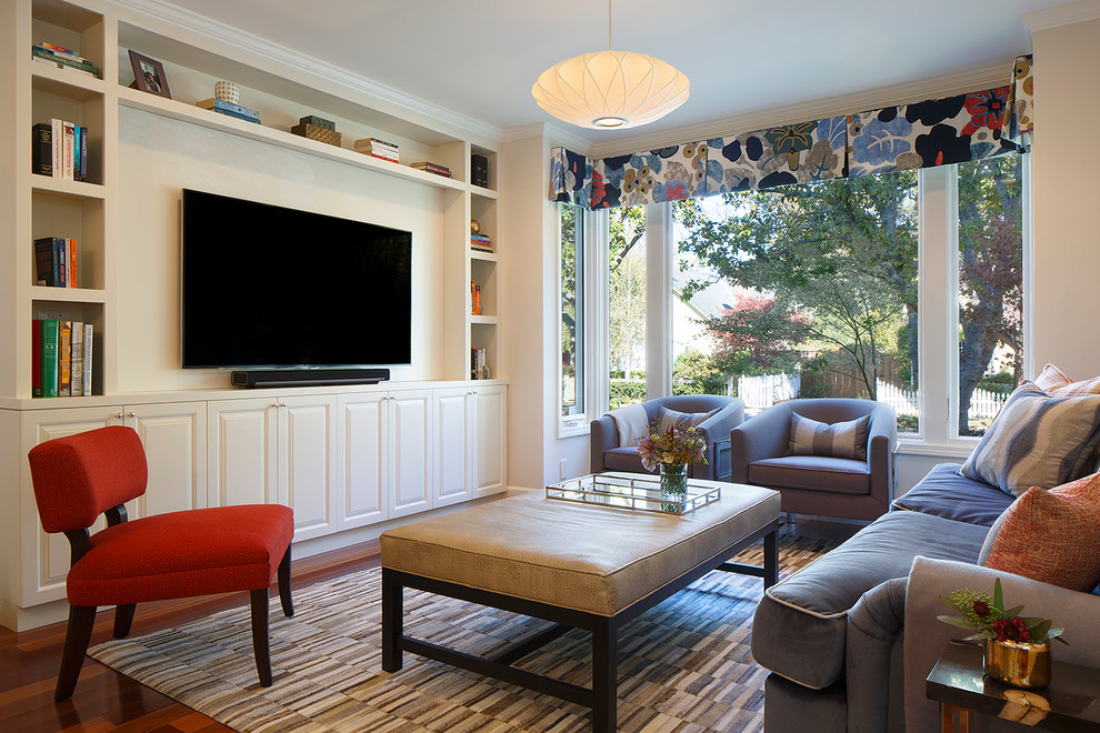 Photo of a mid-sized transitional open concept family room in San Francisco with grey walls, medium hardwood floors, no fireplace and a built-in media wall.