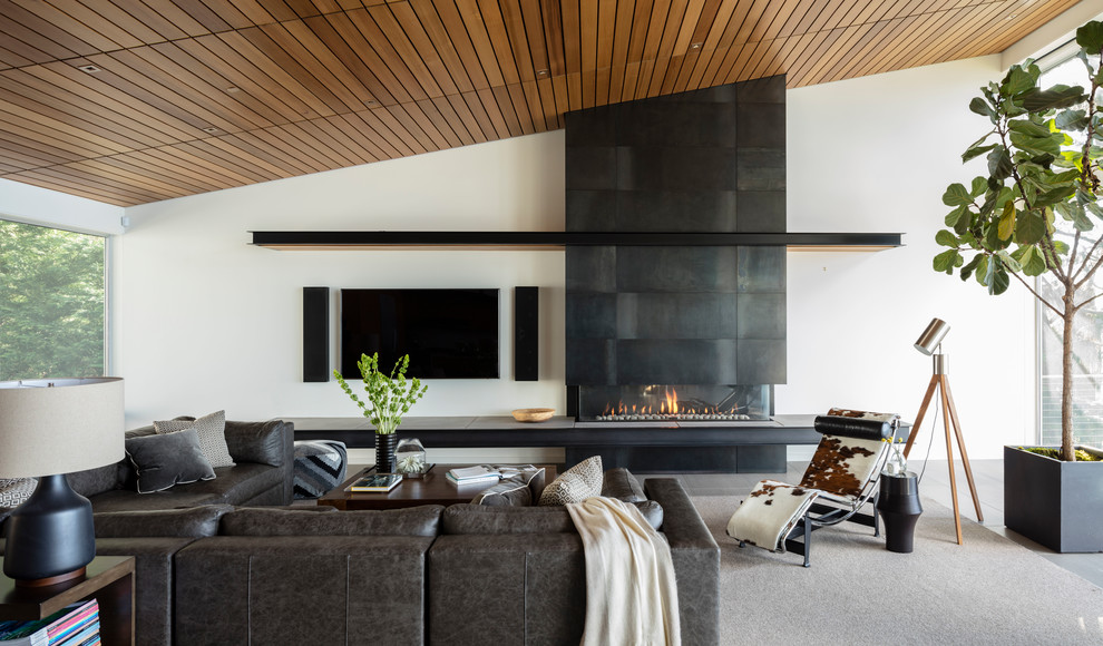 Inspiration for a contemporary open concept living room in Seattle with white walls, porcelain floors, a ribbon fireplace, a metal fireplace surround, a wall-mounted tv and grey floor.