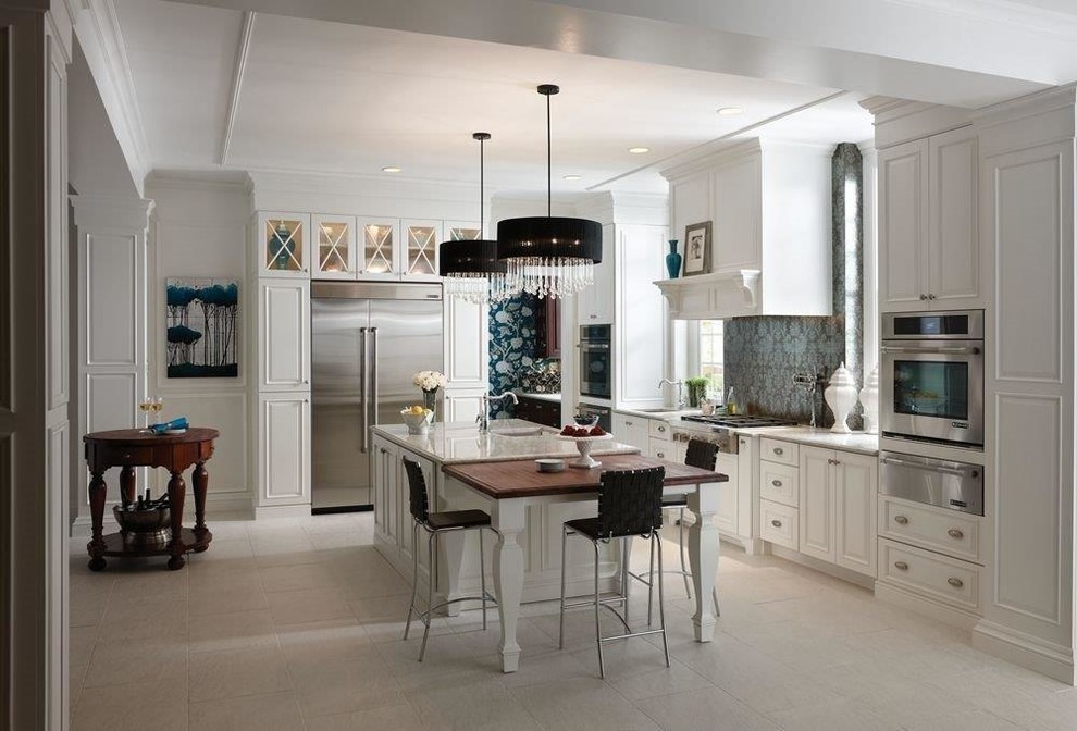 Inspiration for a mid-sized traditional l-shaped open plan kitchen in Tampa with an undermount sink, recessed-panel cabinets, white cabinets, quartzite benchtops, blue splashback, stainless steel appliances, slate floors, with island and white floor.