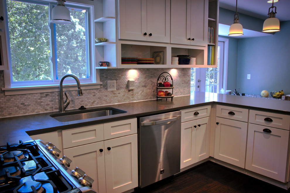 Kitchen - mid-sized transitional u-shaped dark wood floor and brown floor kitchen idea in DC Metro with an undermount sink, shaker cabinets, white cabinets, quartz countertops, gray backsplash, matchstick tile backsplash, stainless steel appliances and a peninsula