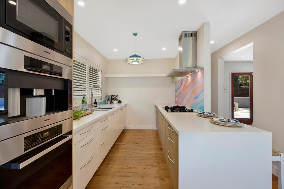This is an example of a beach style kitchen in Central Coast.