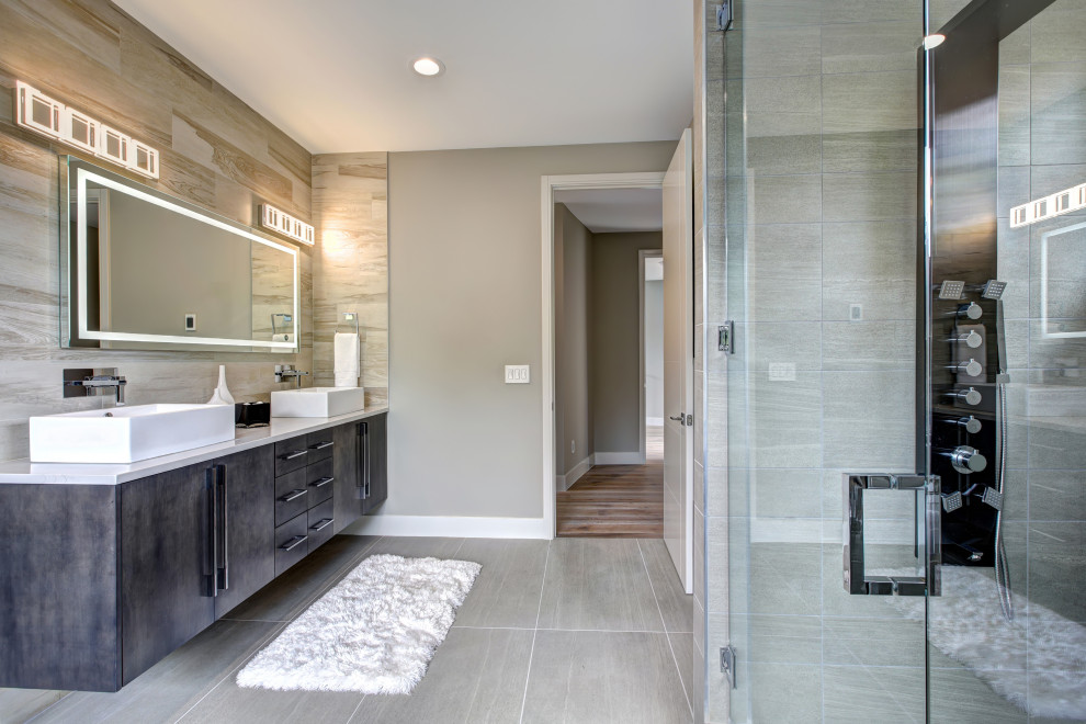 Design ideas for a mid-sized contemporary master bathroom in San Diego with flat-panel cabinets, black cabinets, a corner shower, a one-piece toilet, gray tile, ceramic tile, grey walls, ceramic floors, a console sink, marble benchtops, grey floor, a hinged shower door, turquoise benchtops, a double vanity and a floating vanity.