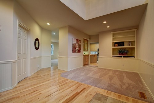 Shall I replace great room carpet with wood floors? and what color ... - Option 3) Leave the existing light oak flooring as is and replace carpets  with a warm color that blends nicely and warms up the existing wood floor  ($)