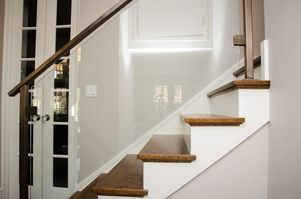 Mid-sized transitional wooden straight staircase photo in Chicago with painted risers