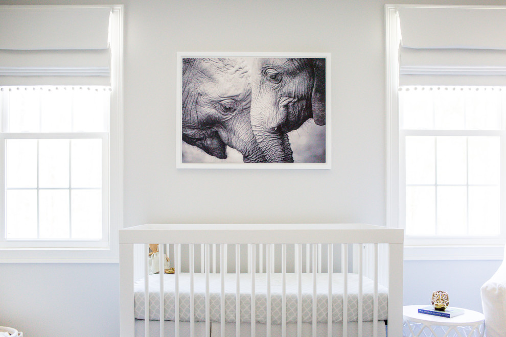 Design ideas for a mid-sized transitional nursery for girls in Boston with grey walls, carpet and grey floor.