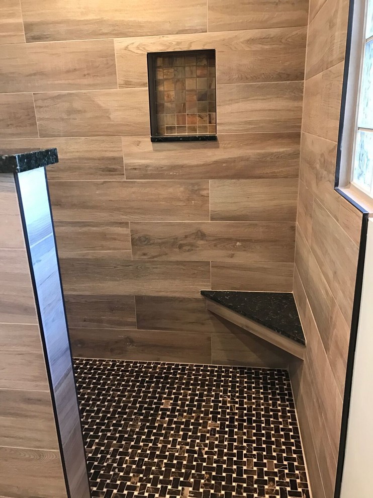 Example of a mid-sized mountain style master beige tile and porcelain tile alcove shower design in Phoenix