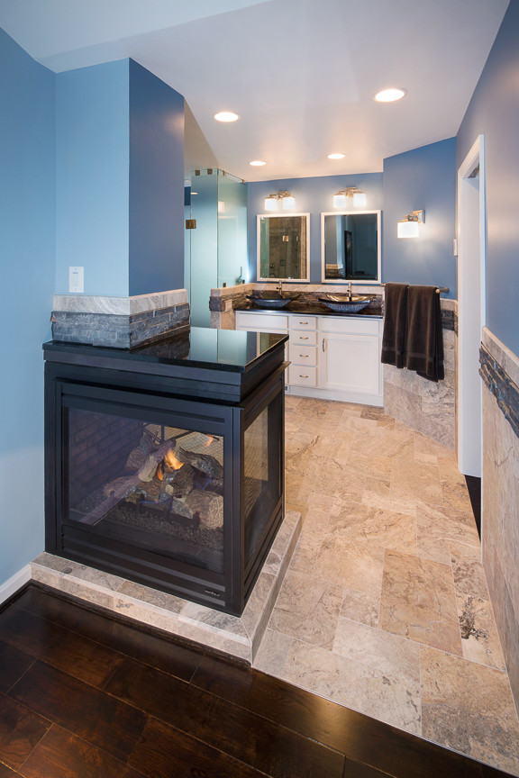 Design ideas for a mid-sized contemporary master bathroom in DC Metro with a vessel sink, shaker cabinets, white cabinets, granite benchtops, a corner shower, a two-piece toilet, multi-coloured tile, stone tile, blue walls and marble floors.