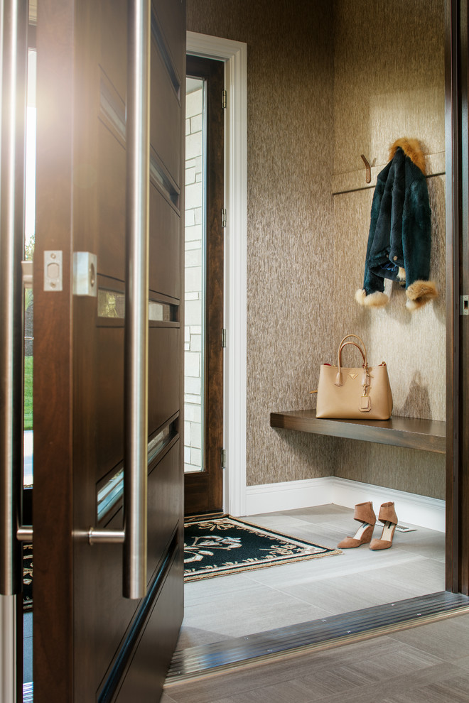Inspiration for a mid-sized transitional porcelain tile and gray floor vestibule remodel in Omaha with brown walls