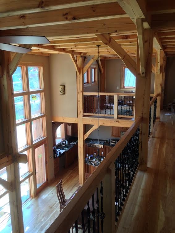 Inspiration for a large rustic light wood floor and beige floor hallway remodel with beige walls