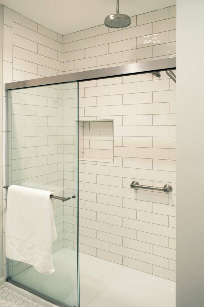 Example of a mid-sized transitional beige tile and subway tile alcove shower design with beige walls