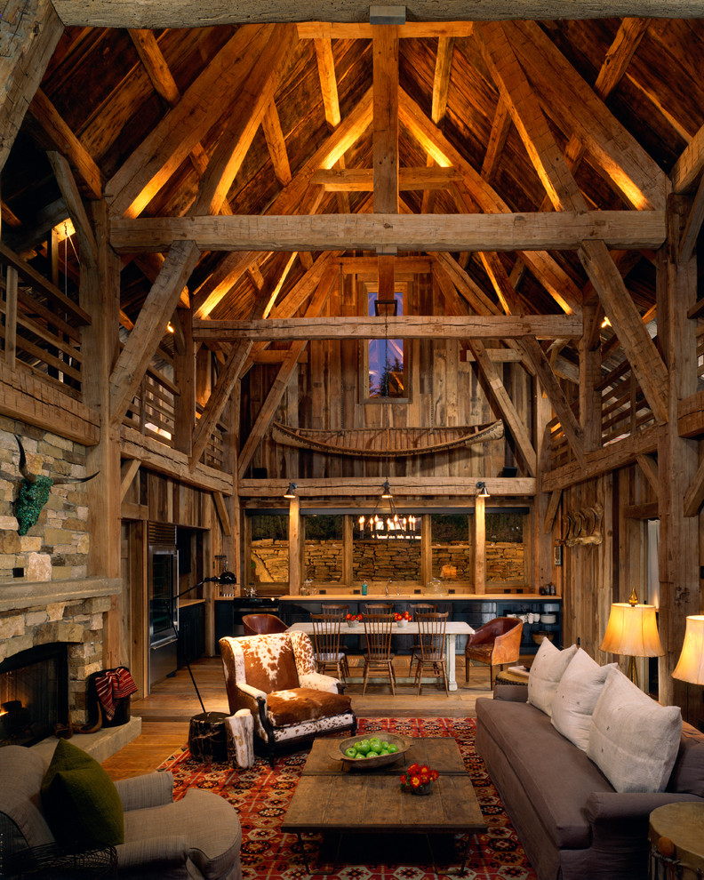 Inspiration for a country open concept living room in Denver with a standard fireplace and a stone fireplace surround.