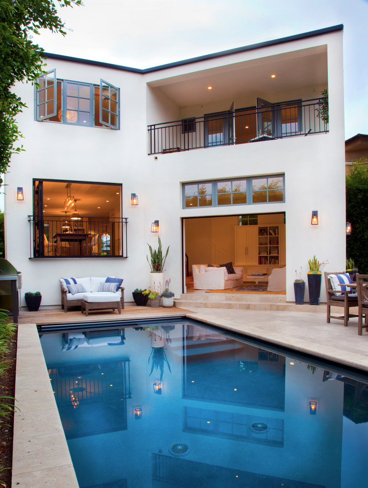 This is an example of a transitional backyard rectangular pool in San Diego.