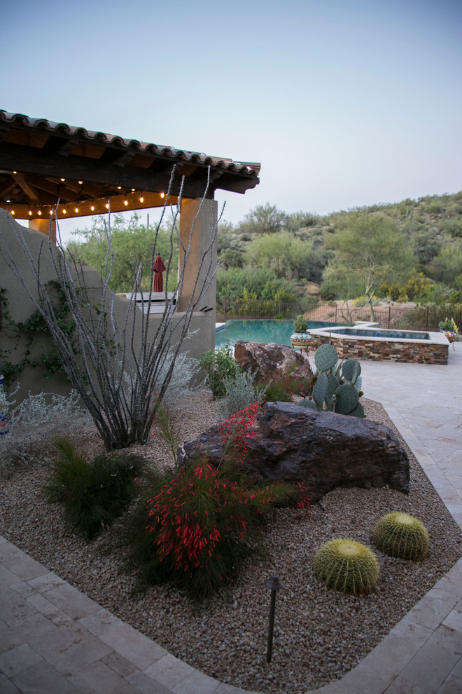 Design ideas for a large backyard patio in Phoenix with an outdoor kitchen, concrete pavers and a gazebo/cabana.