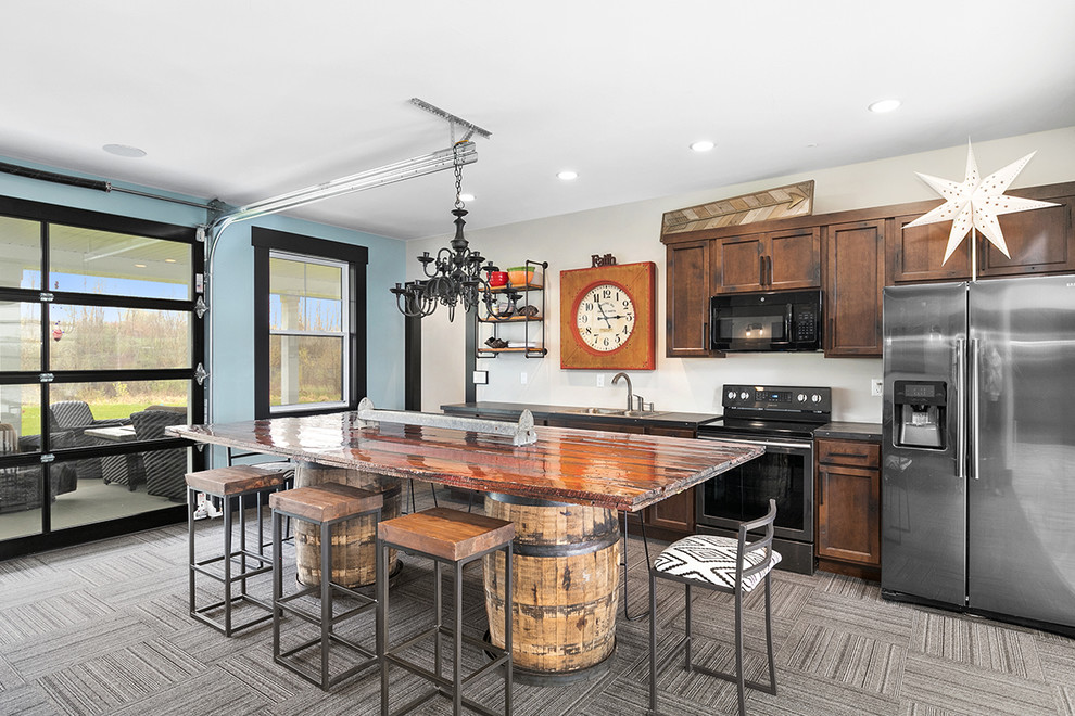 Design ideas for a country kitchen in Grand Rapids with grey floor, a double-bowl sink, shaker cabinets, dark wood cabinets, stainless steel appliances, with island and black benchtop.
