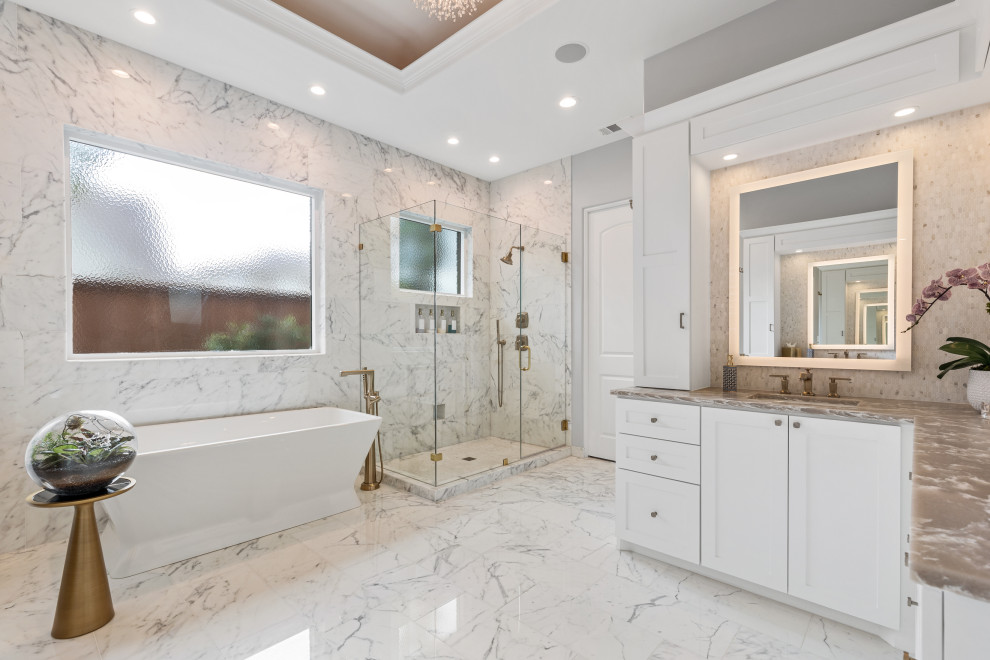 Large elegant master white tile and marble tile marble floor, white floor, single-sink and coffered ceiling bathroom photo in Dallas with shaker cabinets, white cabinets, a one-piece toilet, gray walls, an undermount sink, quartz countertops, a hinged shower door, beige countertops and a built-in vanity