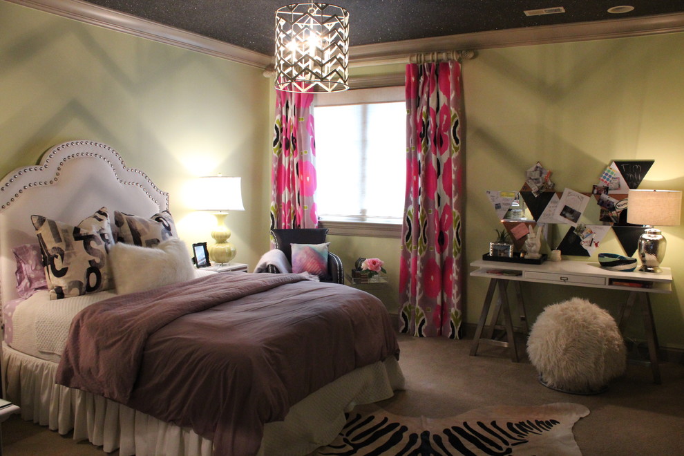 This is an example of a small transitional bedroom in St Louis with green walls and carpet.