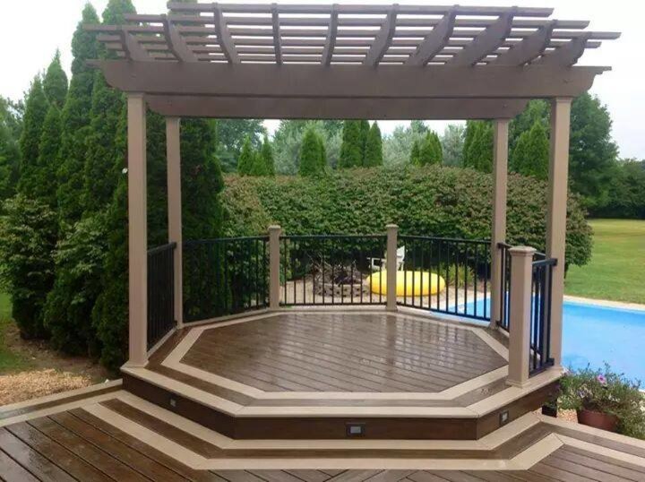Example of a large minimalist backyard deck design with no cover