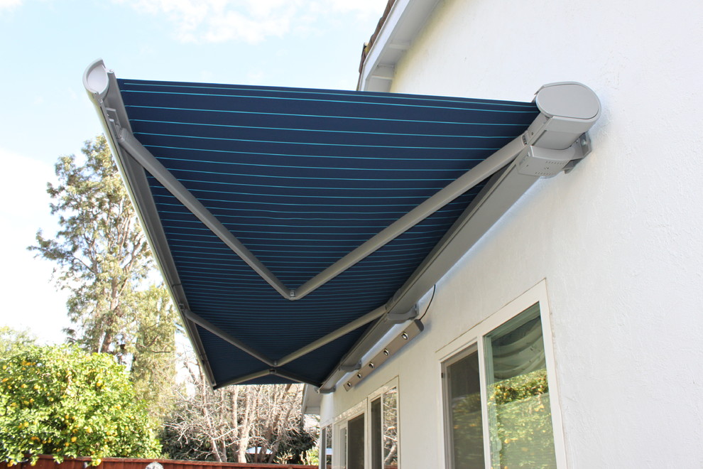 Inspiration for a large modern backyard patio in San Francisco with an awning.