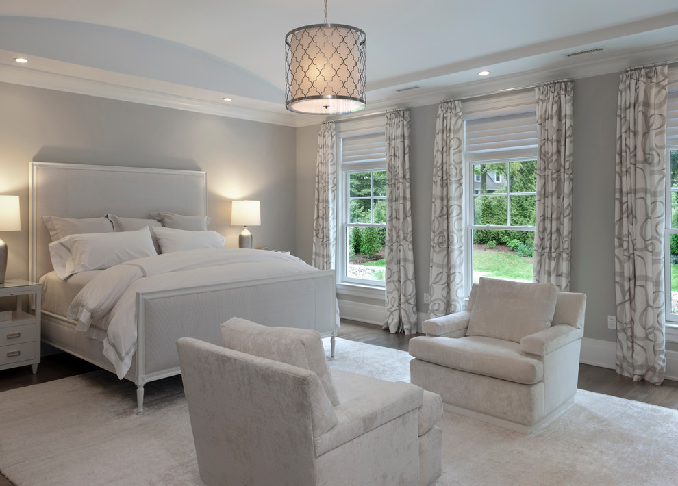 Inspiration for a large transitional master bedroom in New York with grey walls and dark hardwood floors.