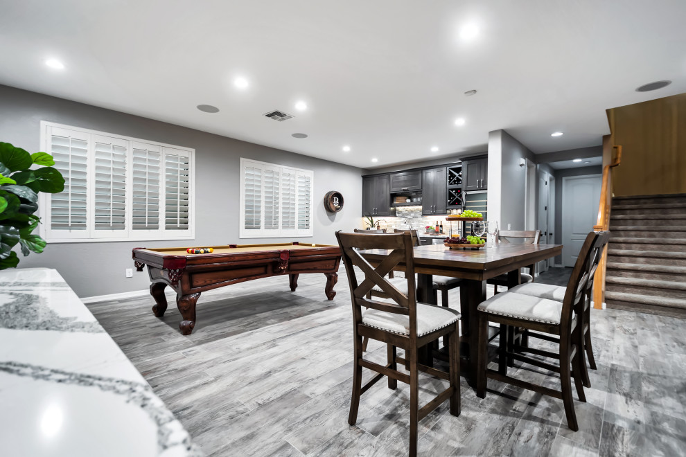Large transitional porcelain tile and multicolored floor basement photo in Phoenix