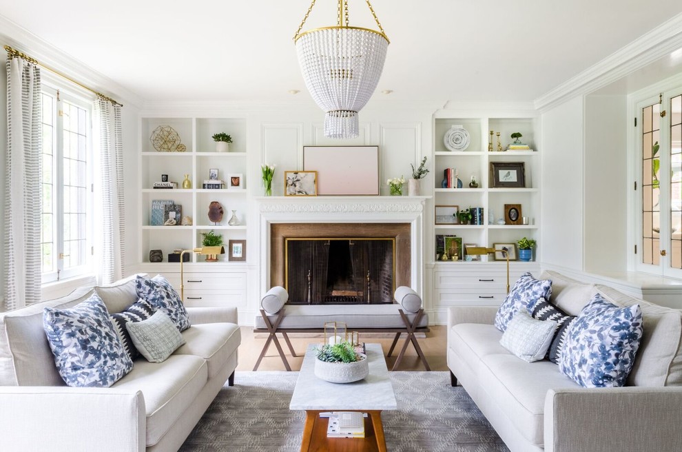 Inspiration for a transitional enclosed family room in Phoenix with white walls, a standard fireplace and a metal fireplace surround.