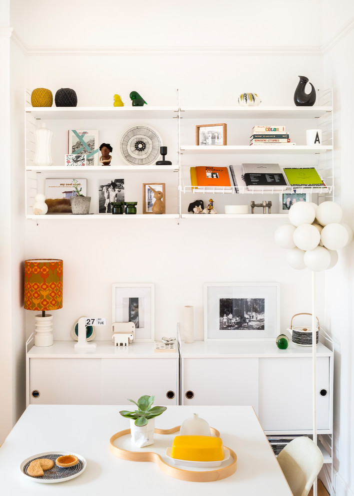 Scandinavian dining room in London with white walls and no fireplace.